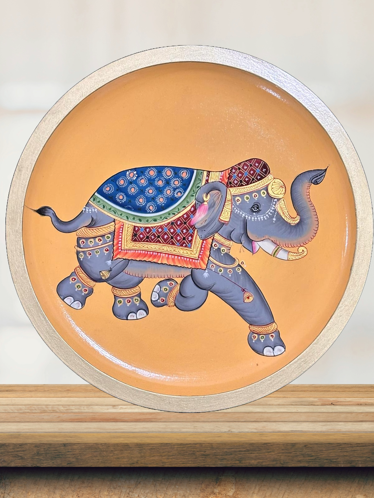Pichwai-style painted orange elephant wall plate